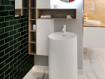 Round pedestal sink with coordinating storage solution