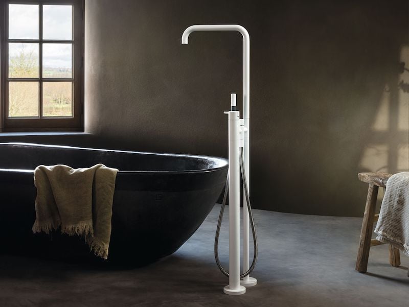 White freestanding floor-mounted tub filler with a square neck