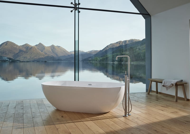 VOLA bath tub in a bathroom with a lake view